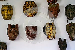 Mayan wooden, handcrafted masks on market for sale in Chichicastenango, Guatemala