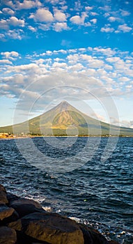 Mayon Volcano is an active stratovolcano in the province of Albay in Bicol Region, on the island of Luzon in the photo