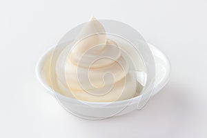Mayonnaise in a dish isolated white background