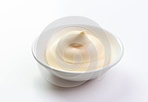 Mayonnaise in a dish isolated white background
