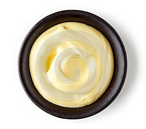 Mayonnaise in round dish on white background
