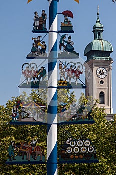 Maypole and Heilig Geist church Munich Germany