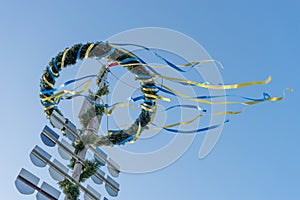 Maypole with wreath and ribbons