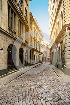 Riga, Latvia. Maza Smilsu iela street in Riga. Narrow medieval cobbled street in the old town in Riga.