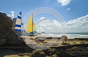 Mazatlan, mexico. Man picking up sea shells. photo