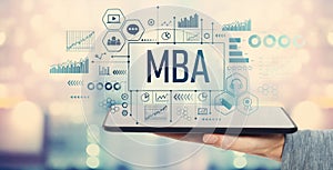 MBA with tablet computer photo