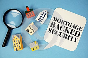 MBS Mortgage-Backed Security text with house models on blue background