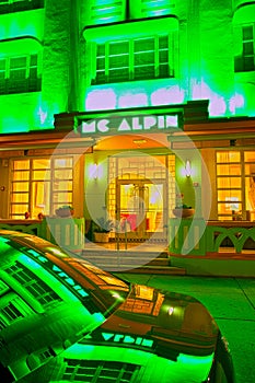 :Mc Alpin Illuminated hotel , car reflection, and restaurants