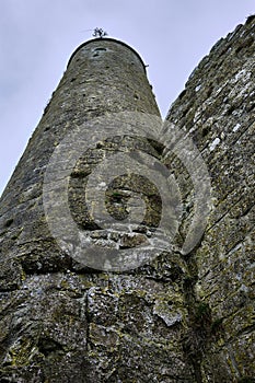McCarthy's Tower viewed from the base in the medieval monastery of Clonmacnoise, during a rainy summer day