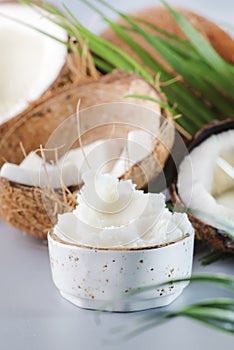 MCT Coconut butter or coconut oil. Organic healthy food, beauty and SPA concept. Gray background. Copy space