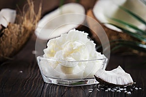 MCT Coconut butter or oil. Organic healthy food, beauty and SPA product. Wooden background. Copy space