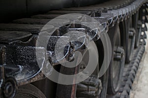 MCU higher angle detail of tread links on captured US Army tank on display in Vietnam variation