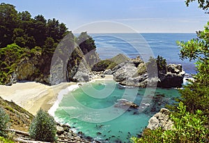 Beautiful beach and McWay Falls on the Big Sur, California USA in the summer on a sunny day