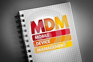 MDM - Mobile Device Management acronym on notepad, technology concept background