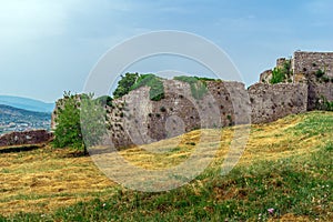 Meadow with dry cut grass in the courtyard of Rozafa Castle in Albania