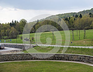 Meadow, forest, road and Soviet T-34 tank on concrete base