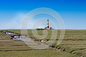Meadow landscape with lighthouse