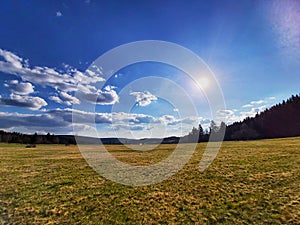 Meadow with Novohrad mountines on background