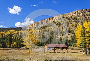 Meadow with shelter at fall time near Creede Colorado photo