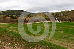 Meadow with tiny church