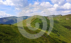 Meadows in the Svydovets mountain range. View of Mount Vorozheska