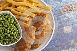 A Meal of Beer Battered Fish Chips and Peas