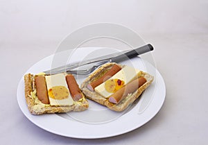 A meal of bread, cheese and viennas