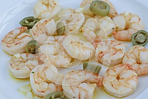 Meal Cooked prawns with pepper on plate in softfocus