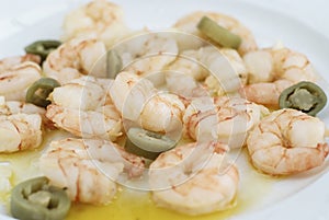 Meal Cooked prawns with pepper on plate in softfocus