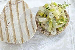 Meal -Grilled tuna steak with onion anmd pores