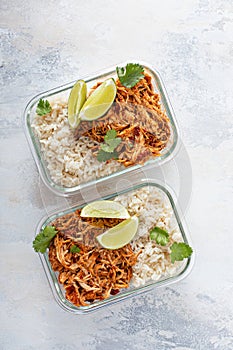 Meal prep containers with pulled chicken with salsa and rice