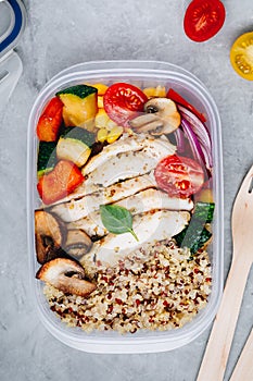 Meal prep containers with quinoa, grilled vegetables and chicken