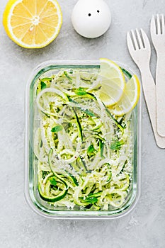 Meal prep lunch box containers Spiralized zucchini noodles pasta with mint, lemon and parmesan cheese