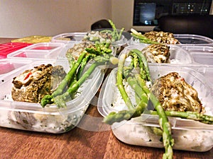 Meal preparations for 6 days with rice, stuffed chicken and asparagus