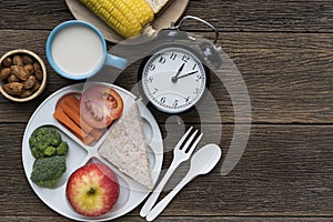 Meal time with alarm clock at lunch time