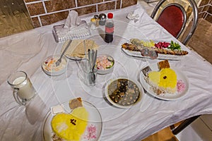 Meals in Iran. Ghormeh Sabzi and Kabab Koobideh, both with saffron ric