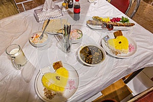 Meals in Iran. Ghormeh Sabzi and Kabab Koobideh, both with saffron ric