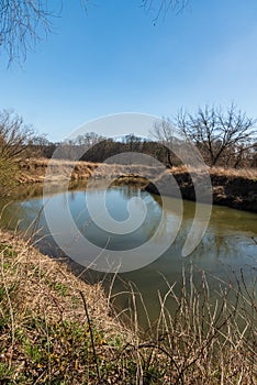 Meandering Odra river in early spring CHKO Poodri in Czech republic photo