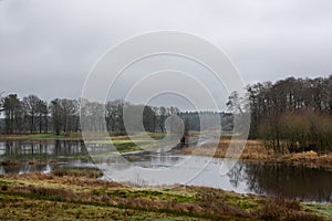 Meandering river overflows its banks photo