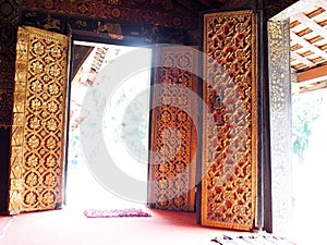 Meaningful buddhism arts decorative ornaments inside temple doors WAT XIENG THONG