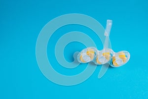 Means for disinfection and washing of a toilet bowl, toilet block of white yellow color on a blue background with copy