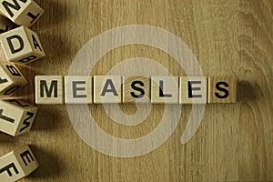 Measles word from wooden blocks