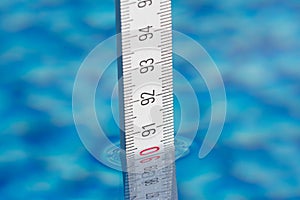 Measure water depth with a folding ruler