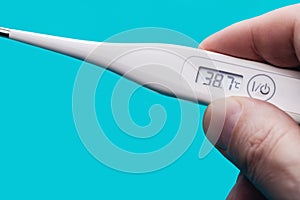 Measurement of body temperature with digital thermometer.