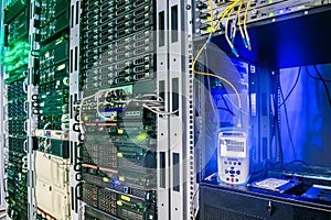 Measurement of the optical signal level by the reflectometer in the server room of the data center. Racks with servers and routers