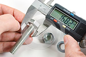 Measurements by a digital caliper in the master`s hand