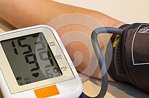 Measuring blood pressure close-up. Too high blood pressure