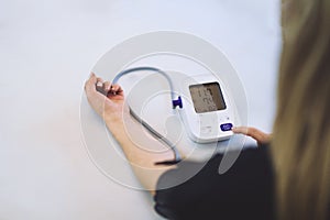 Measuring blood pressure on patient