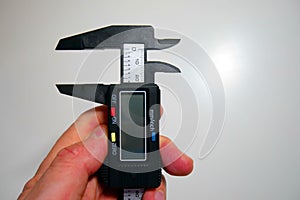 Measuring with a caliper. Electronic digital vernier caliper details and close-up