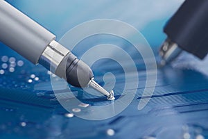 Measuring electronic signal using oscilloscope on the PCB. Electronics repair and digital technology